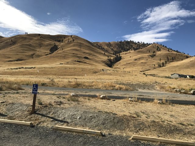 The trail starts on the far side of the road. Chelan Butte is to the right