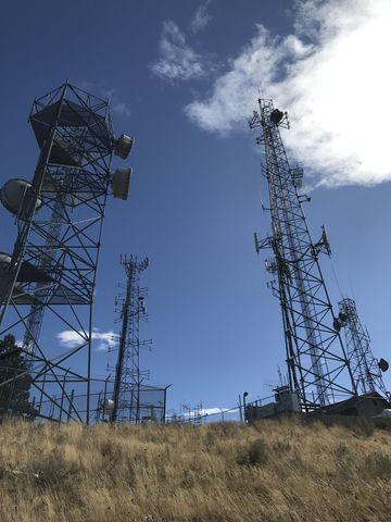 The butte is covered with antennas and towers. There is also a gravel access road, if driving is more your thing…