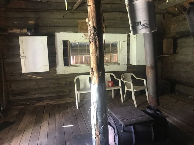 The inside of Big Creek Cabin. Note the stove pipe is not connected.
