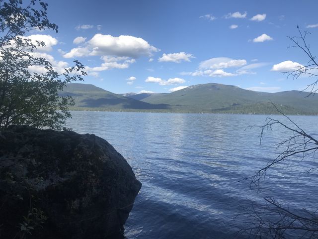 A boulder and lakeviews