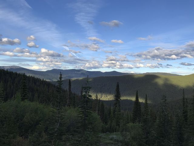 View east in dramatic evening light, with long shadows. The angry clouds have largely moved on