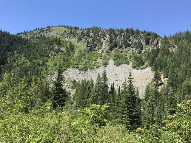 The trail switchbacks up this talus slope