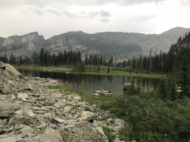 Little Ibex Lake in the foreground; in the background is Scotty Peak to the left and Snowshoe Peak to the right