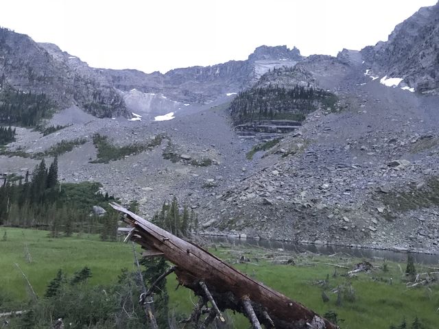 Little Ibex Lake and its meadow in the foreground, and the Ibex headwall in the background (Ibex Peak to the right)