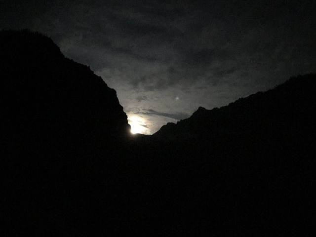 A full moon traversing to Lentz Peak