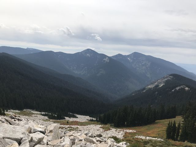 Talus and meadows on Mallard Peaks south face. Black Mountain in the background